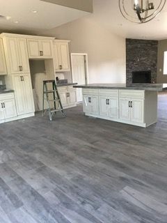 Orange construction sign on chain-link fence: 