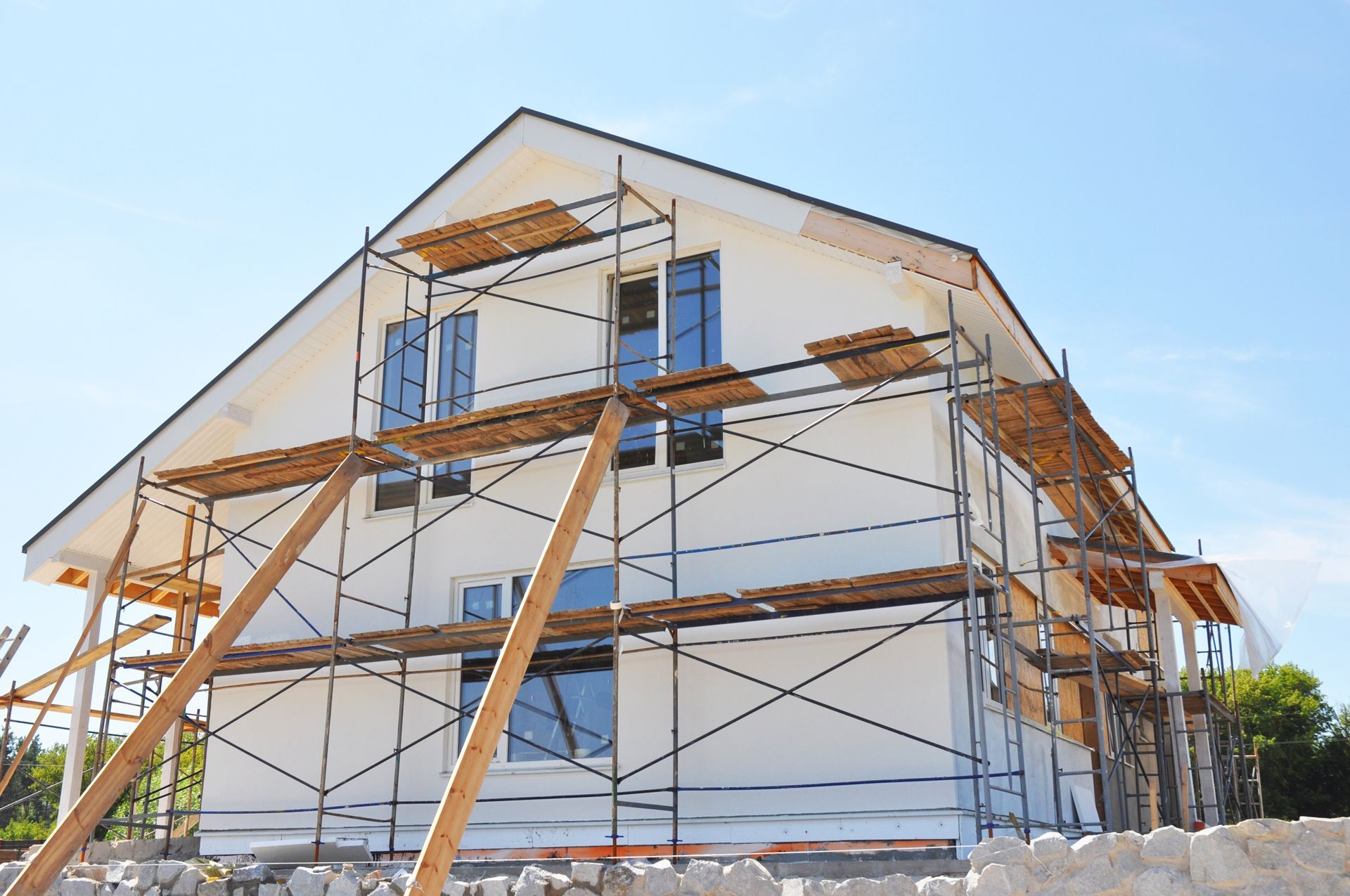 A house is being built with scaffolding around it