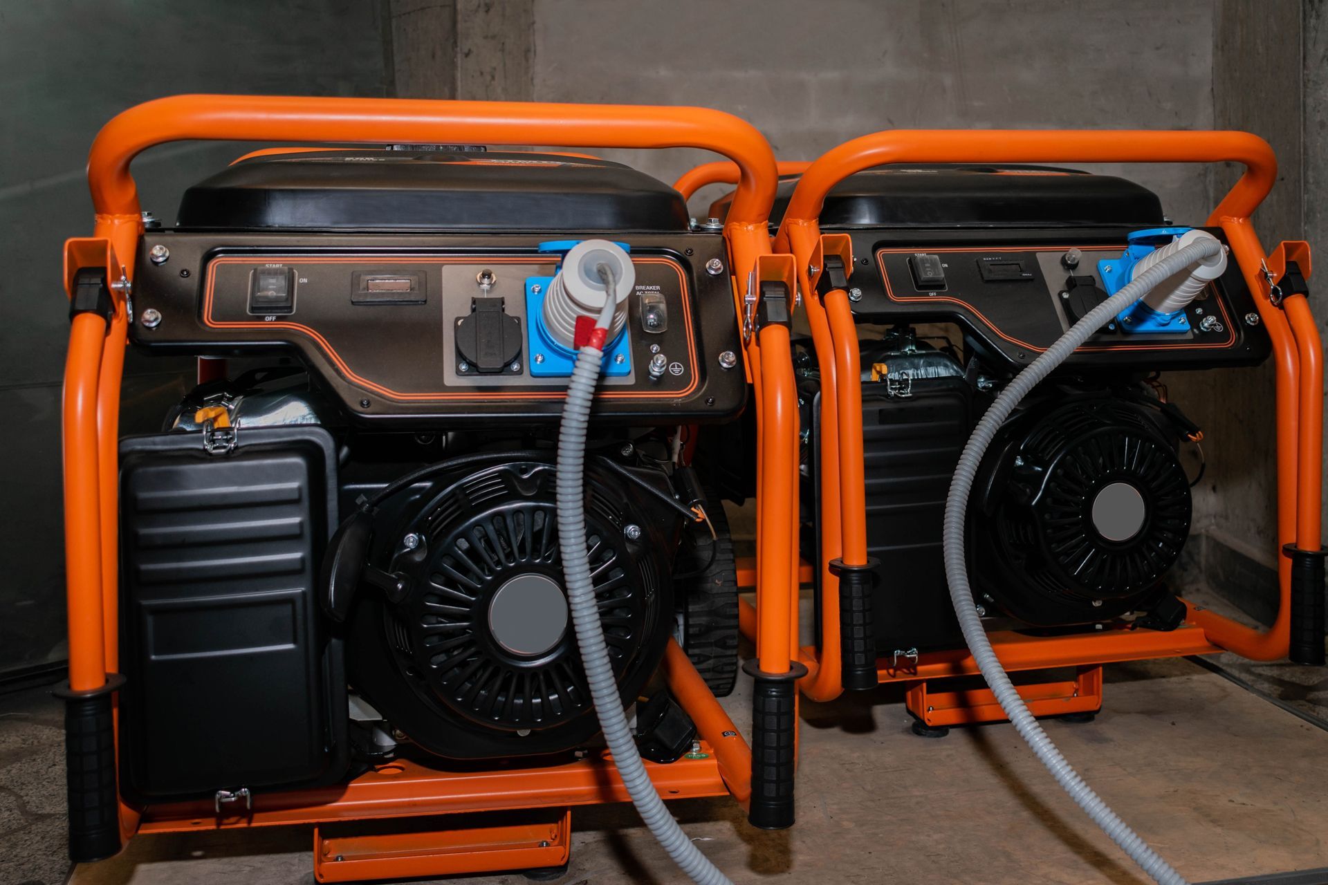 Two orange and black generators are connected to each other