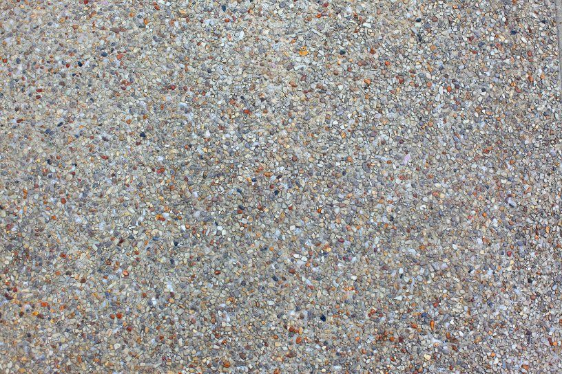 Close up look of exposed aggregate concrete driveway surface installed in a residential driveway in Bendigo VIC.