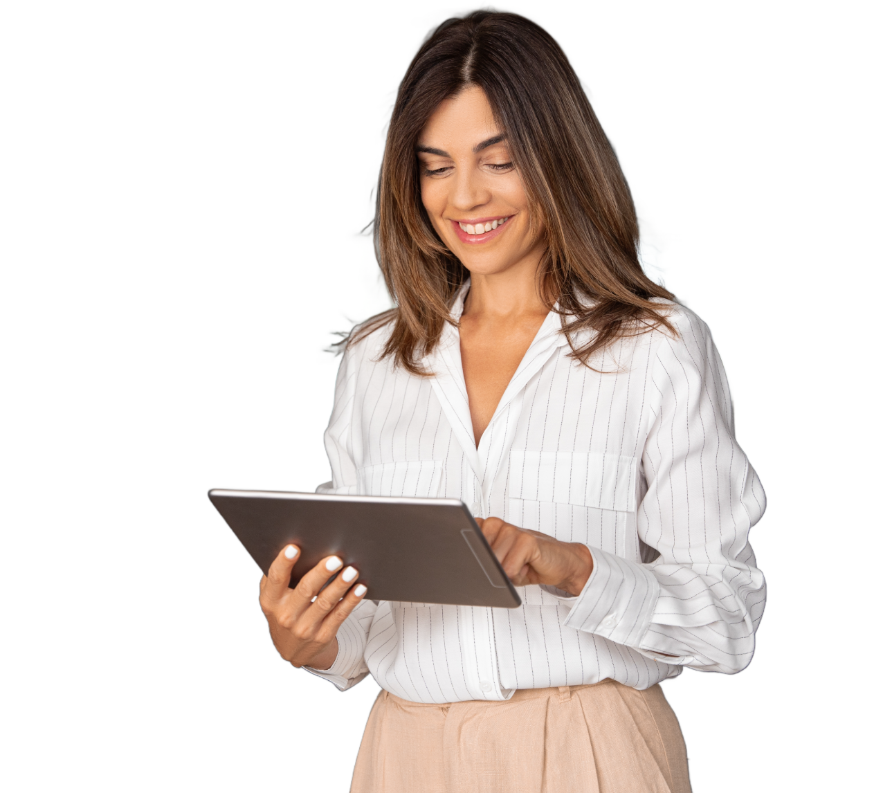 Woman in a white button-down shirt and tan pants smiles while holding a tablet.