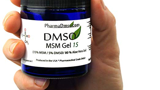 a hand is holding a bottle of PharmaDMSO dmso msm15 gel .