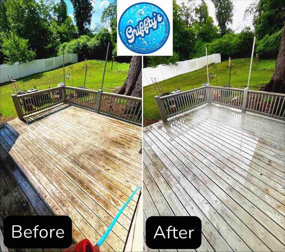 A close up of a wooden deck with water drops on it.