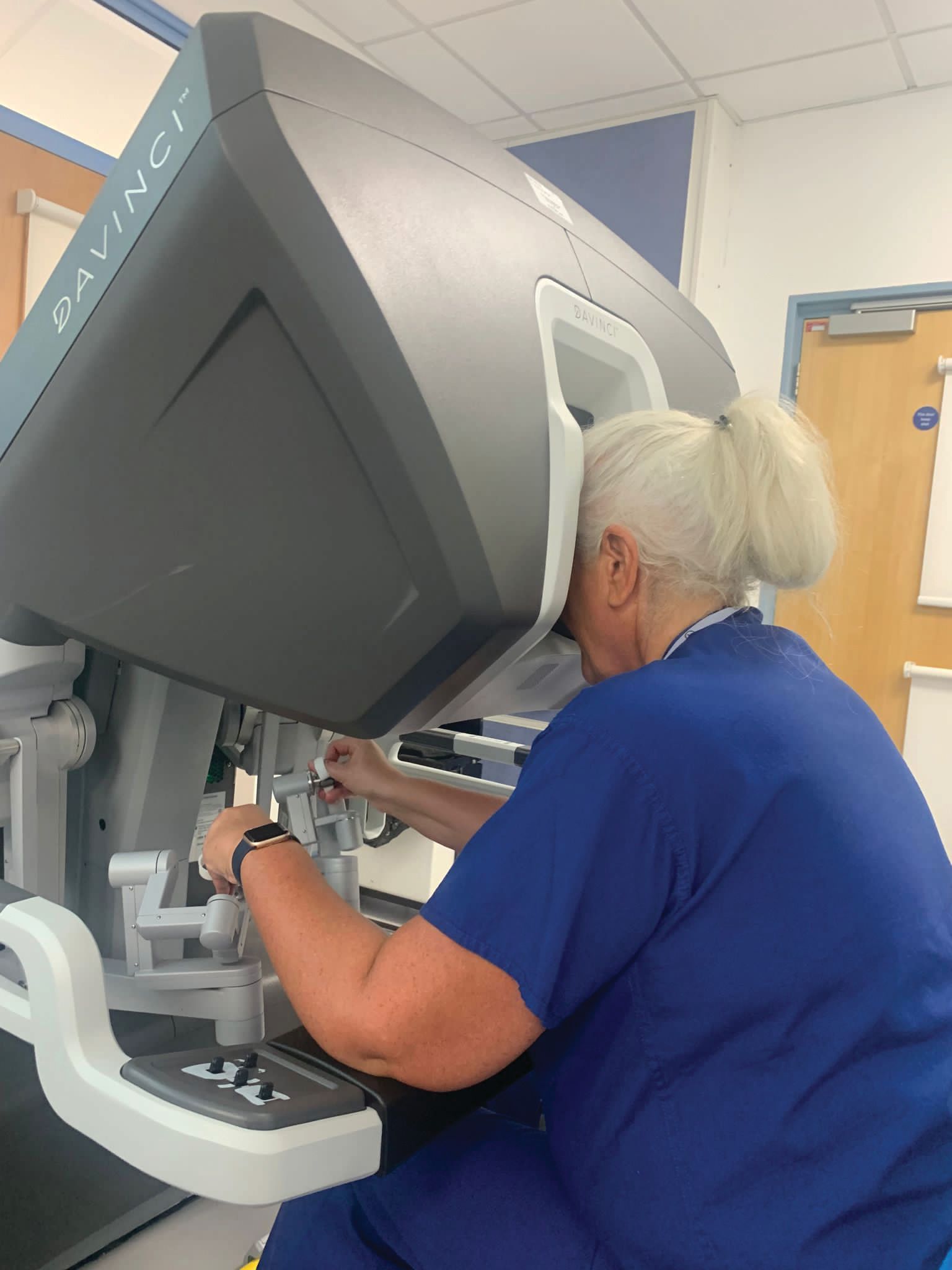 A woman is working on a machine that says private