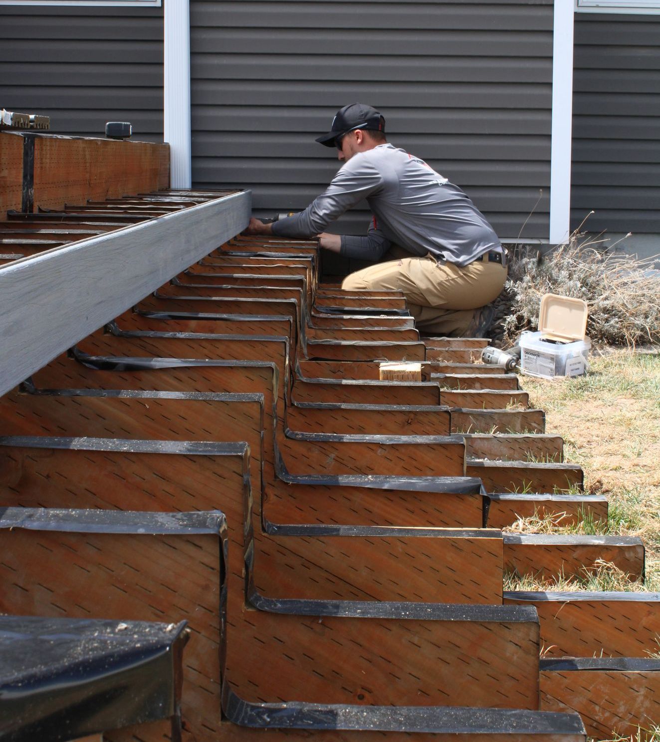 Deck Builder attaching decking to frame 