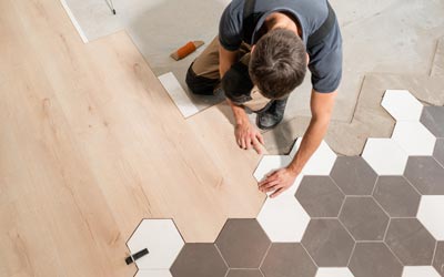 Surface Grinding — Man Removing Tiles in Jacksonville, FL