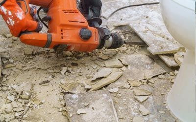 Floor Removal Company — Demolition of Old Tiles with Jackhammer in Jacksonville, FL