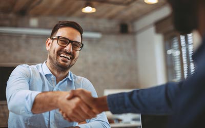 Flooring Consultation — Close Up of Handshake in the Office in Jacksonville, FL