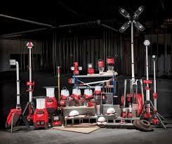 A group of tools are sitting on a wooden floor.