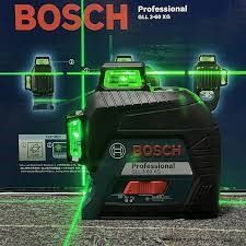 A group of tools are sitting on a wooden floor.