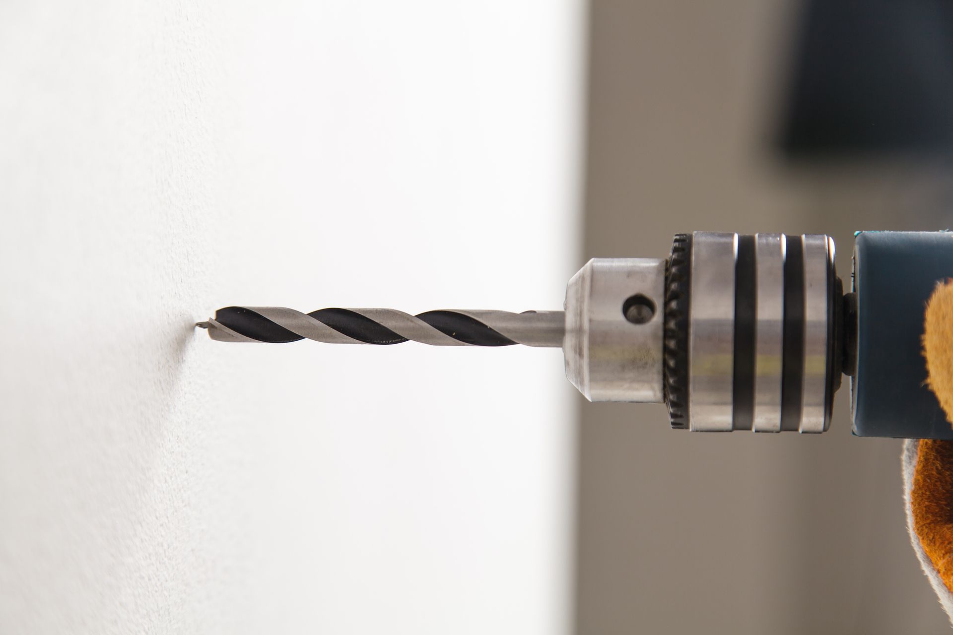 A group of tools are sitting on a wooden floor.