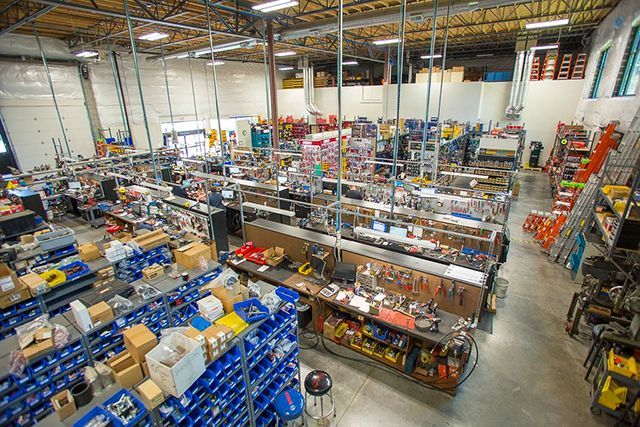 A large warehouse filled with lots of tools and boxes.