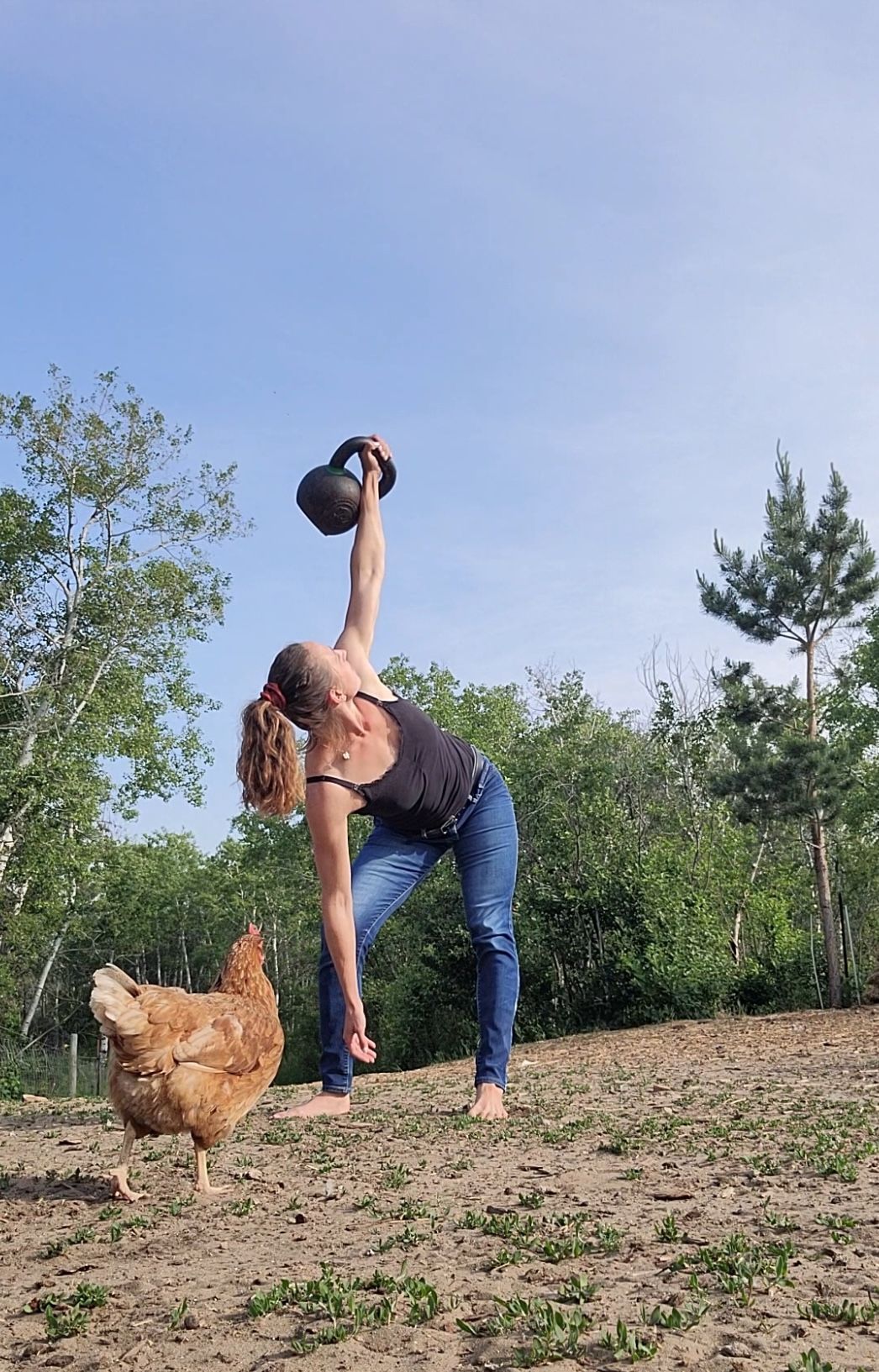 A muscular person performing a barbell back squat in a gym, face showing intense effort.