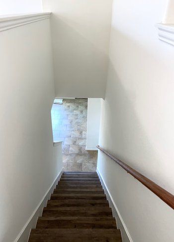 A set of stairs leading up to the second floor of a house.