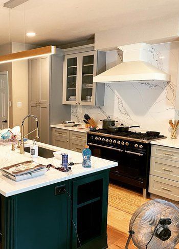 Home in Circle C neighborhood in southwest Austin, TX that had kitchen remodel including new cabinets, cabinet painting, new countertops, and new backsplash completed by Austin Painting and Cabinets