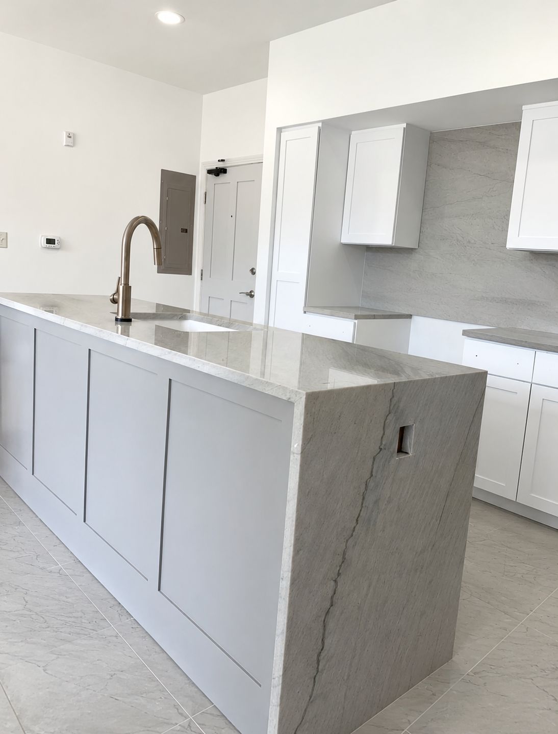 Barton Hills Austin kitchen remodel with quartz waterfall island and painted cabinets