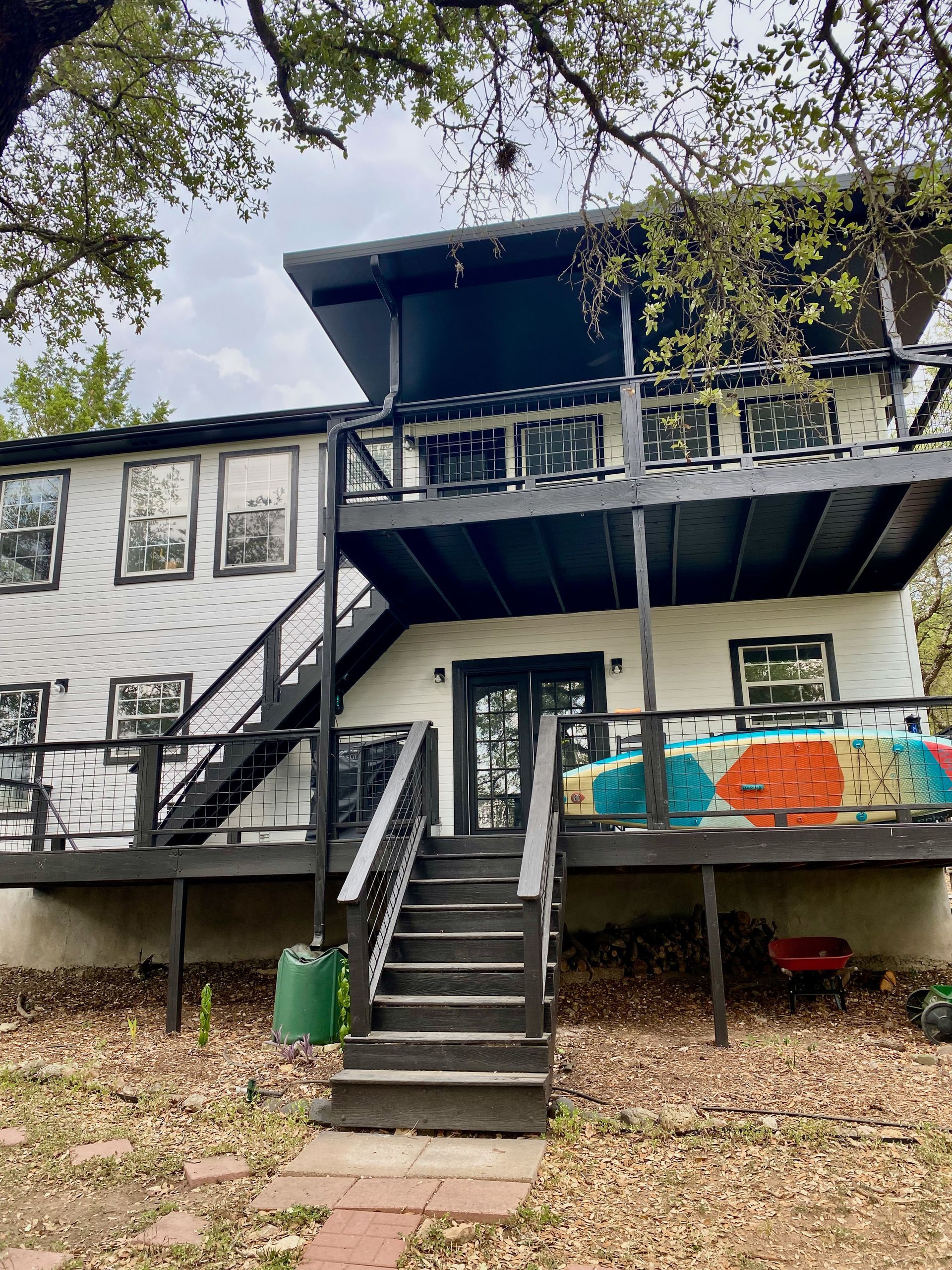 after photo of Austin exterior painting project showing updated deck and full painted exterior