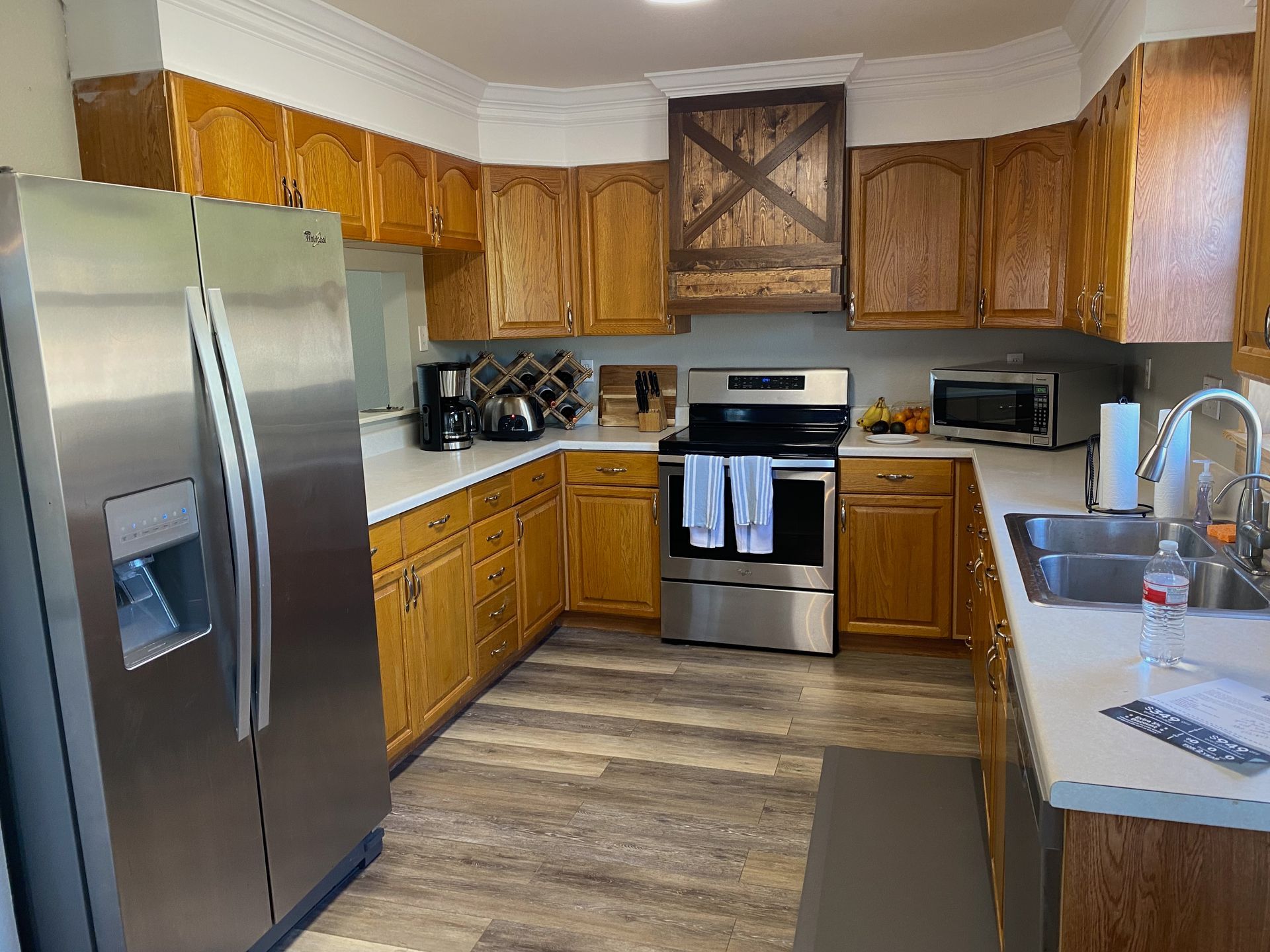 Before photo of Dripping Springs kitchen remodel near Austin with closed layout fur down and outdated finishes