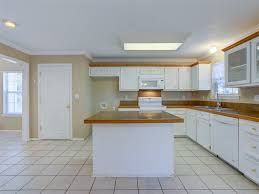 Before photo of Lago Vista kitchen remodel with older cabinets and outdated finishes