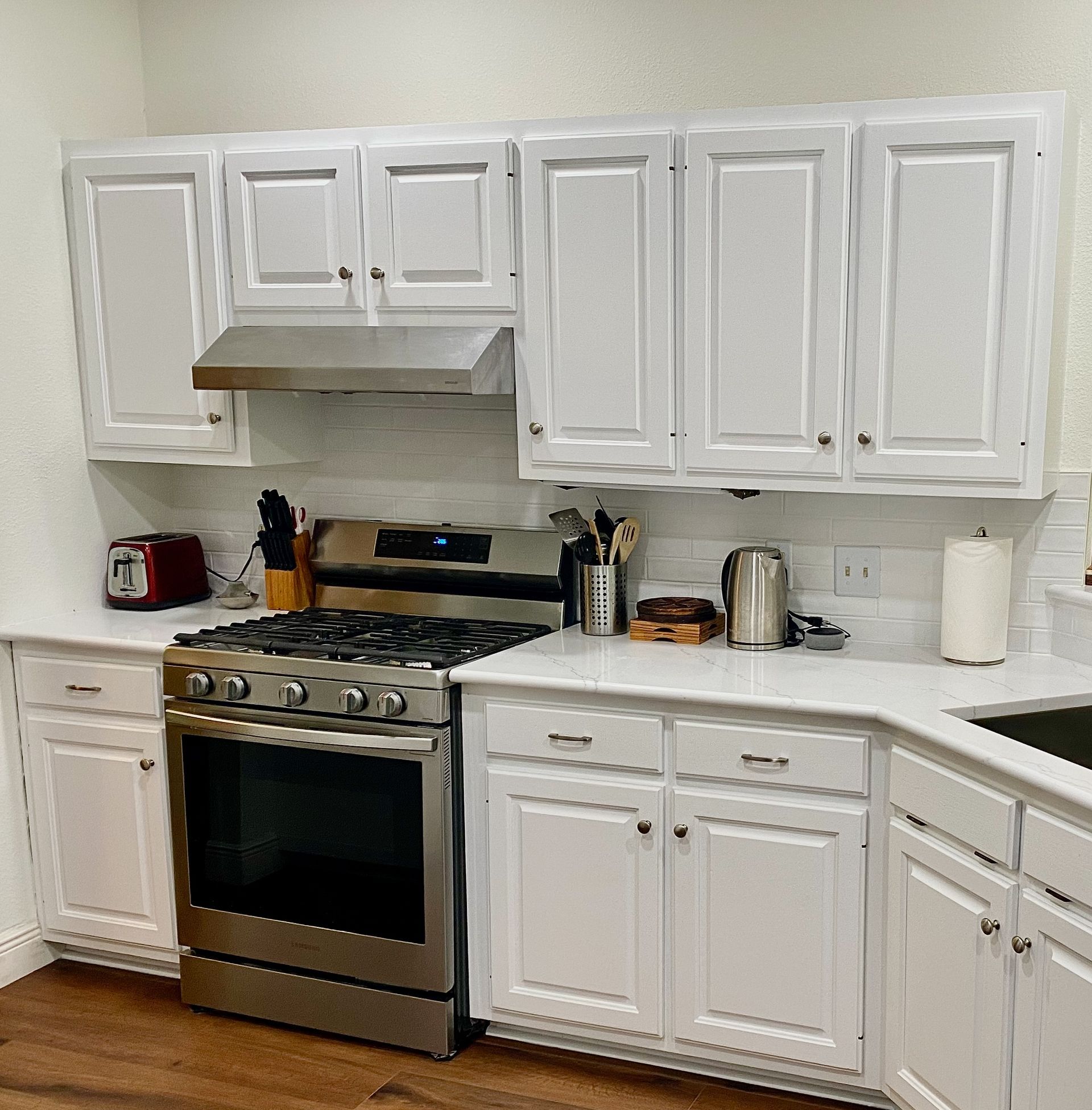 Northwest Austin kitchen remodel with painted cabinets quartz countertops and subway tile backsplash