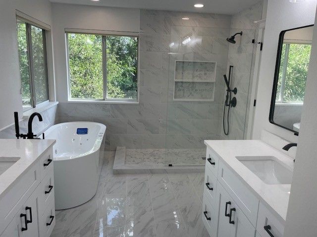 Full master bath remodel in Austin TX including walk in shower, soaking tub, and new tile