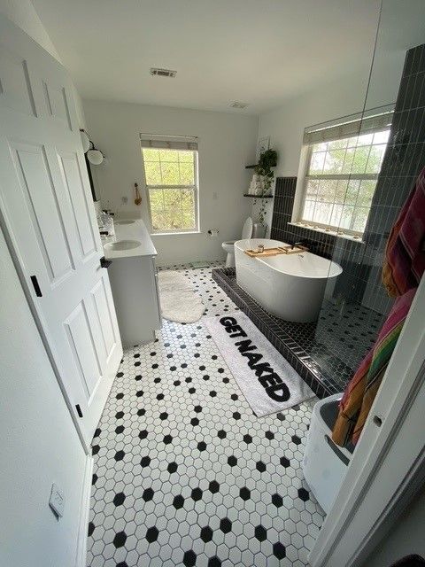 Full gut Lake Travis bathroom remodel in Austin TX with walk-in shower, freestanding tub, new vanity