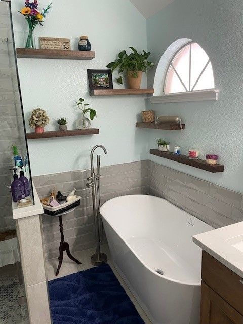 Bathroom remodeling project in Kyle, TX including lighting and fresh paint