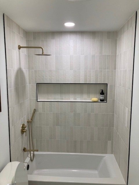 Bathroom refit in Liberty Hill, TX complete with tile tub surround and new lighting