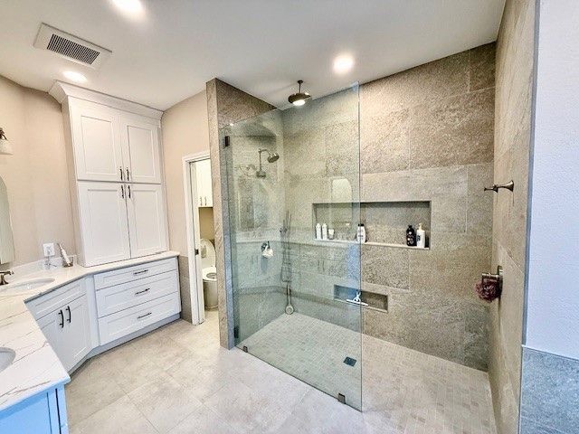Curbless walk-in shower with frameless glass in Cedar Park bathroom remodel