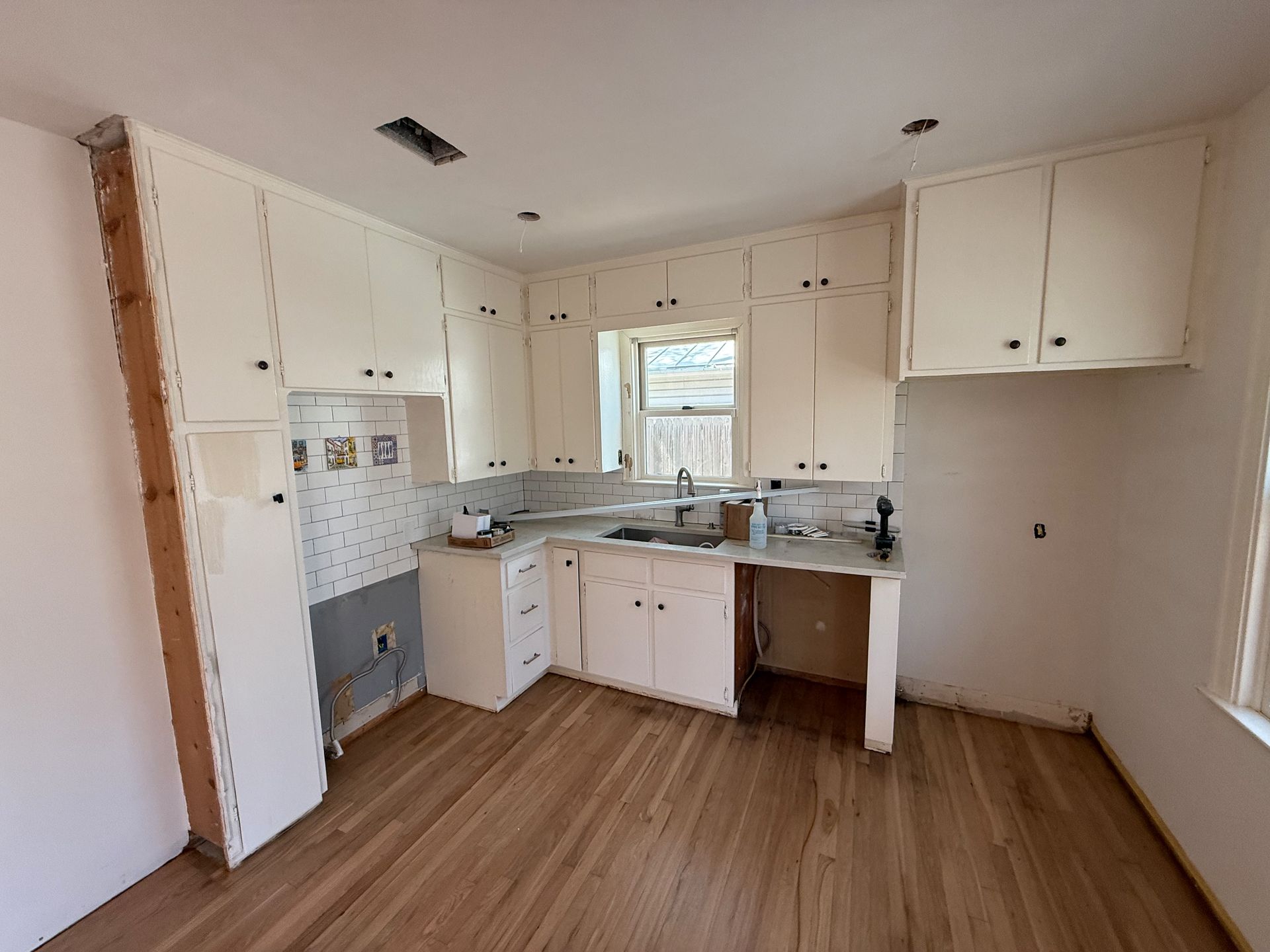 Before Central Austin kitchen remodel with outdated cabinets and layout