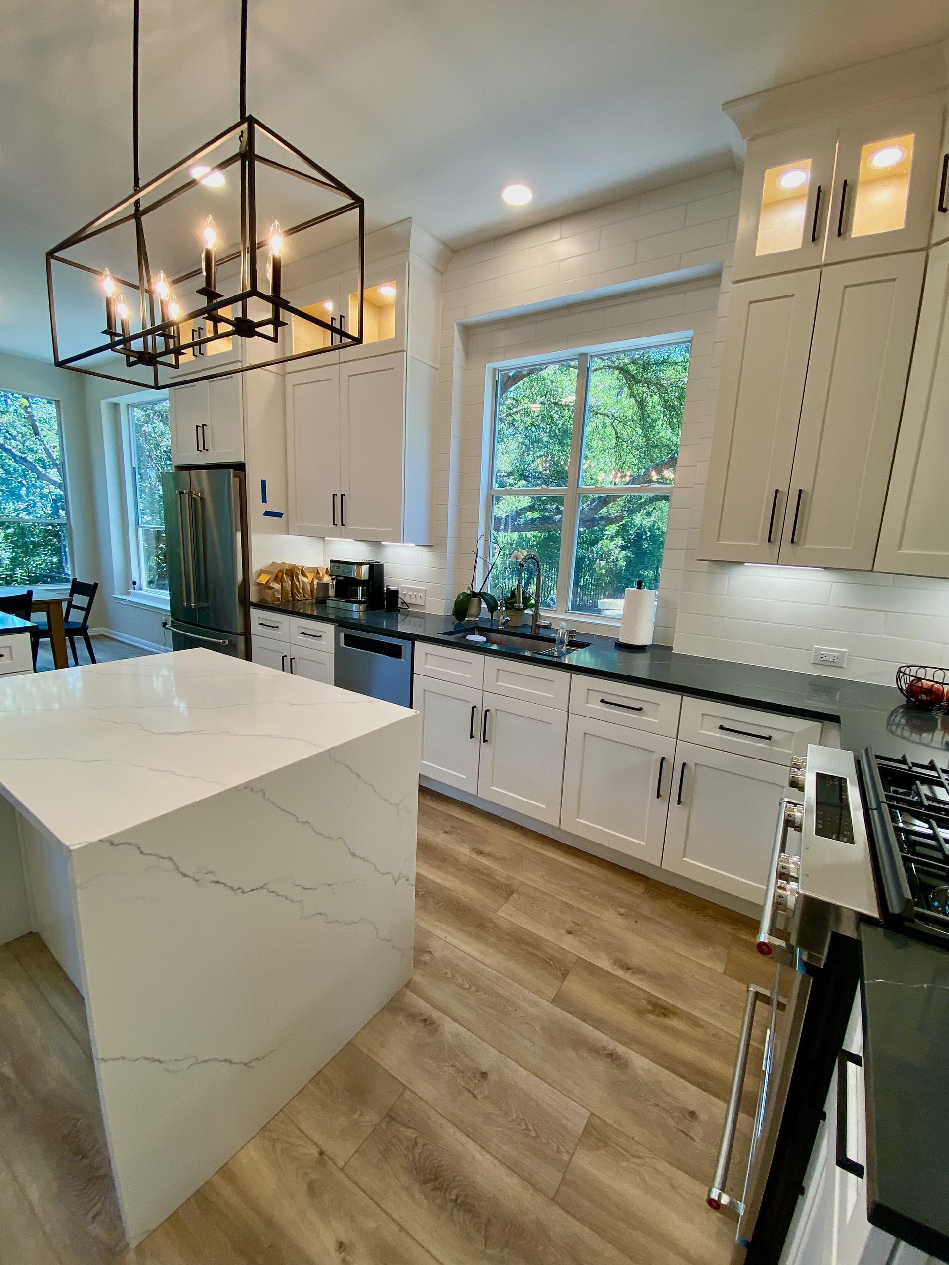 South Austin kitchen remodel in Circle C with new cabinets, quartz countertops, waterfall island,