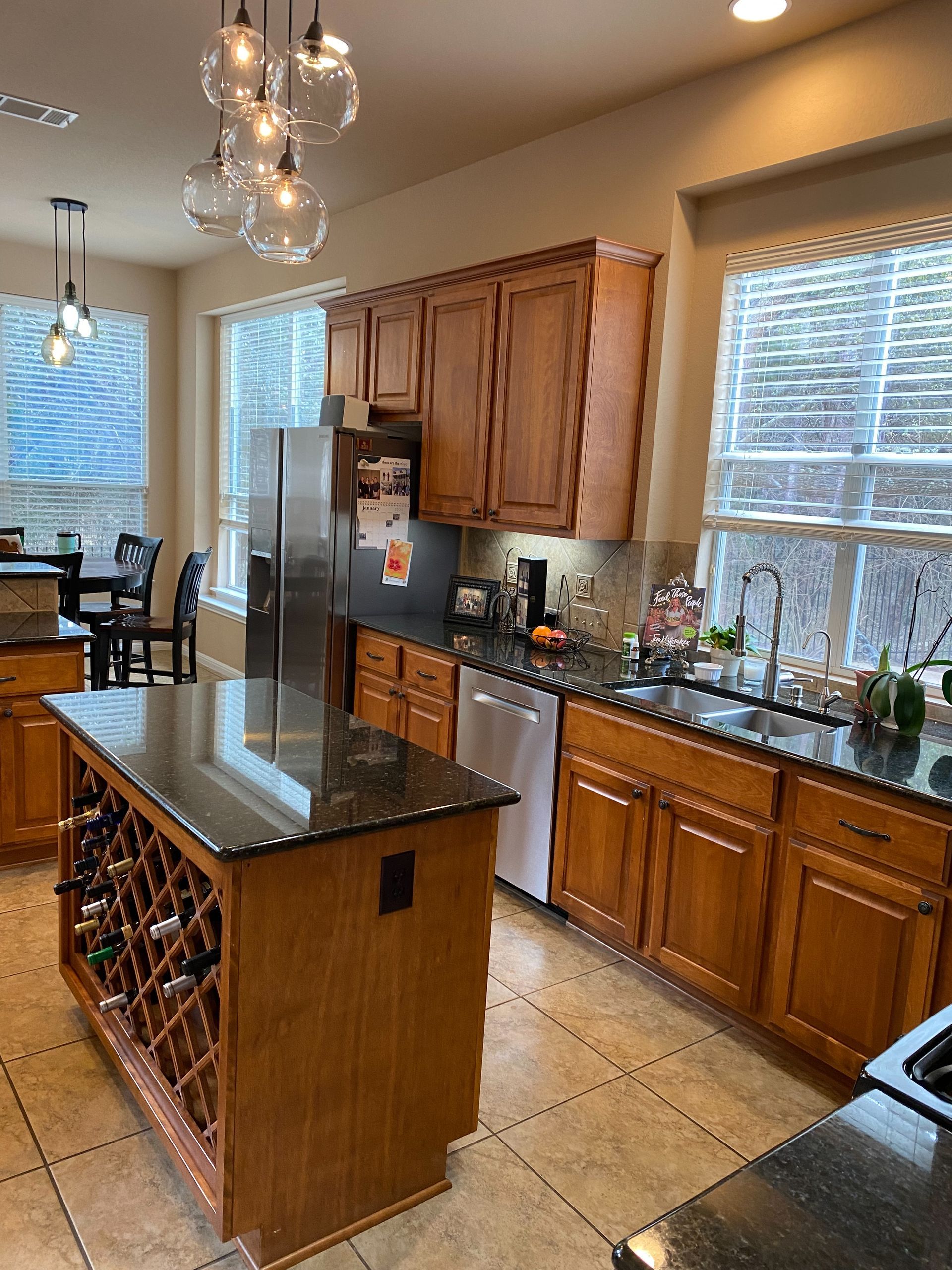 Before photo of Circle C South Austin kitchen remodel with outdated cabinets and finishes