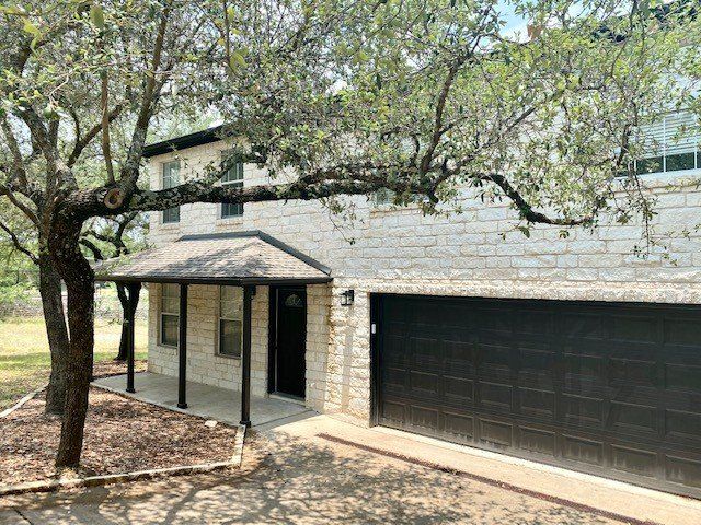 Home in Lake Travis area of Austin, TX that had full kitchen remodel including new cabinets, new countertops, new backsplash, and whole house interior painting and exterior painting completed by Austin Painting and Cabinets