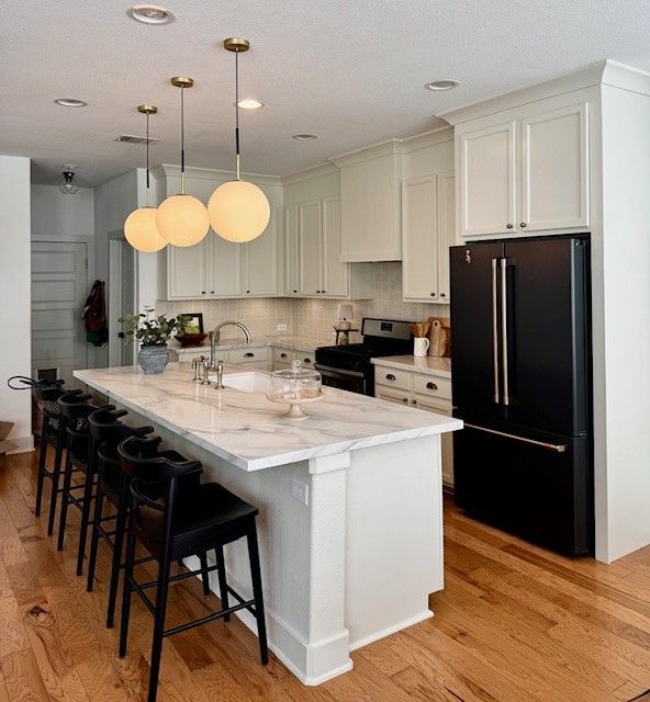 Kitchen remodel in downtown Austin, TX including new cabinets, cabinet painting, new countertops, new backsplash