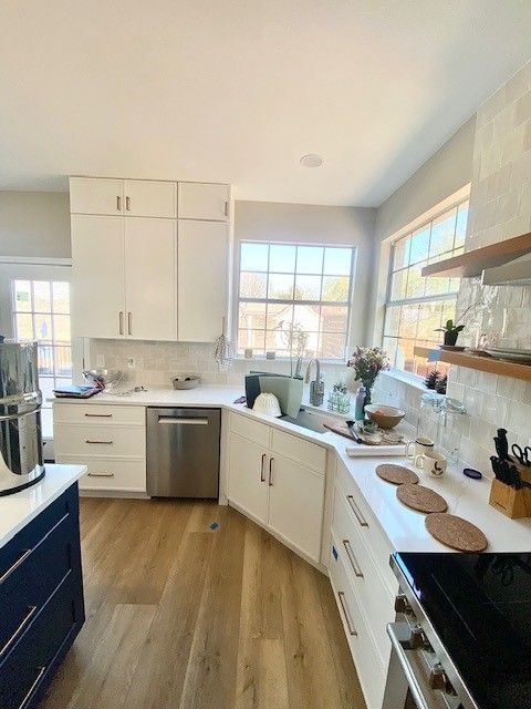 Home in Lakeline area of Austin, TX with full kitchen remodel including new cabinets, cabinet painting, new countertops, and new backsplash completed by Austin Painting and Cabinets