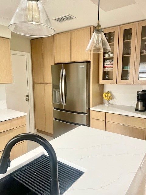 Home in the domain area of north Austin, TX with full kitchen remodel including new cabinets, new countertops, and new backsplash completed by Austin Painting and Cabinets