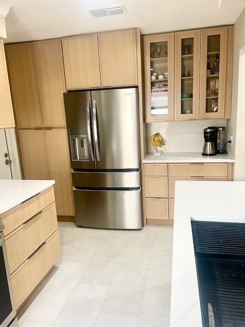 Home in the domain area of north Austin, TX with full kitchen remodel including new cabinets, new countertops, and new backsplash completed by Austin Painting and Cabinets