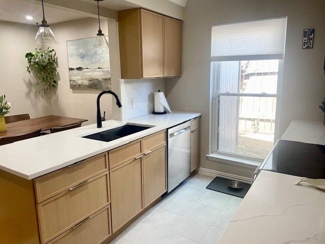 Home in the domain area of north Austin, TX with full kitchen remodel including new cabinets, new countertops, and new backsplash completed by Austin Painting and Cabinets