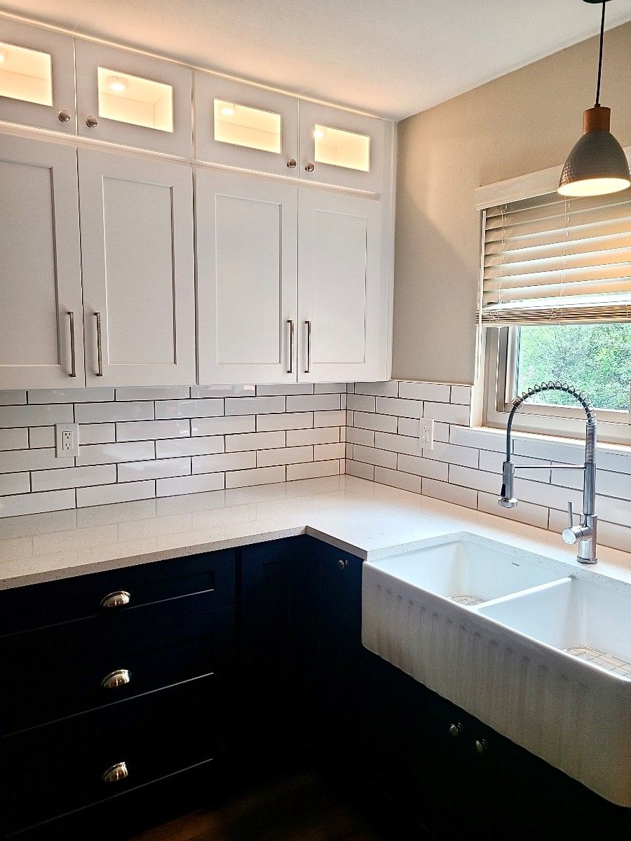 Home in the north Austin, TX with full kitchen remodel including new cabinets, new countertops, and new backsplash completed by Austin Painting and Cabinets