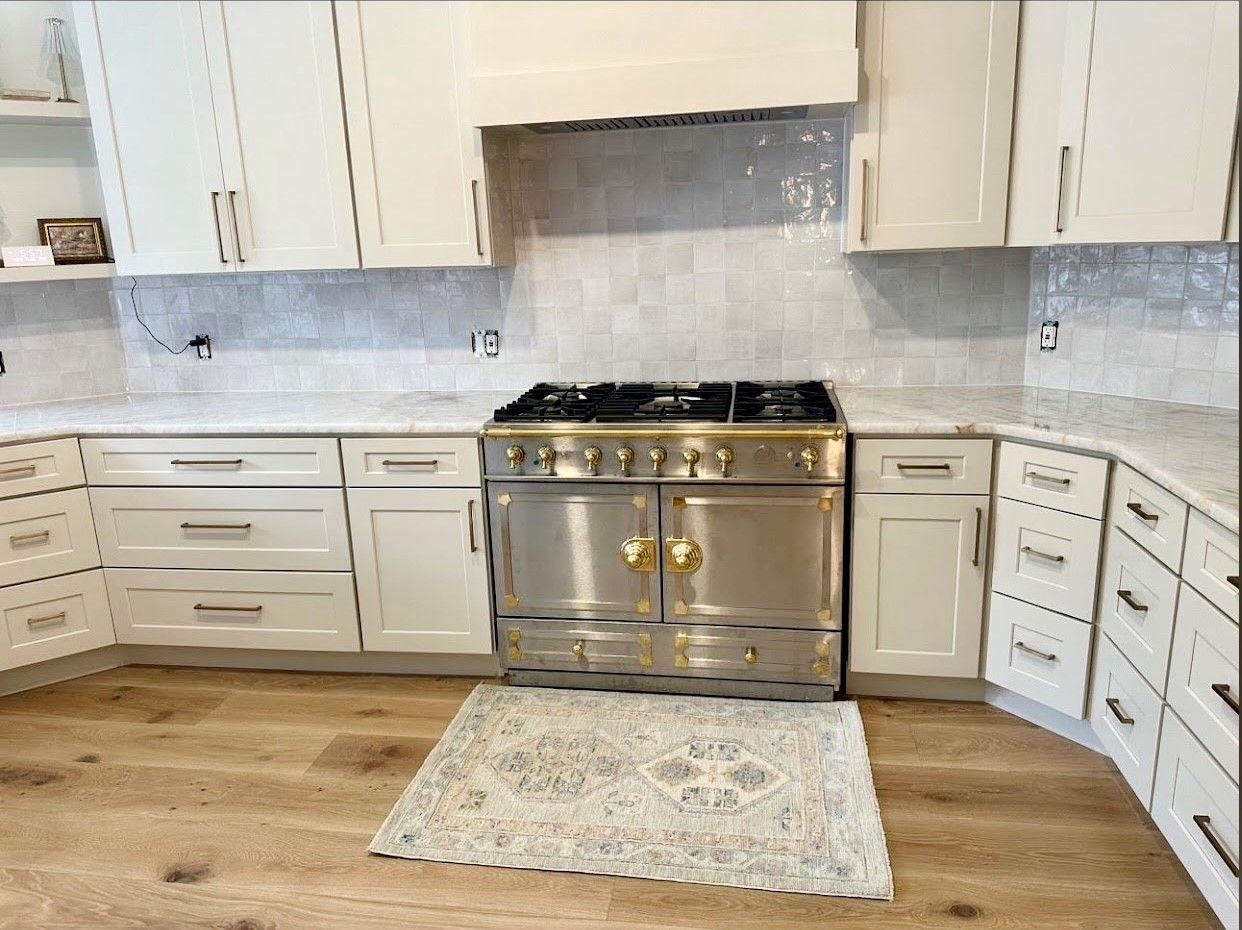 Home in Steiner Ranch neighborhood of Austin, TX with full kitchen remodel including new cabinets, cabinet painting, new countertops, and new backsplash completed by Austin Painting and Cabinets