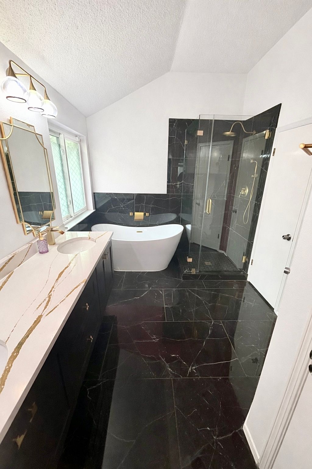 After photo of North Austin master bath remodel with walk in shower frameless glass freestanding tub