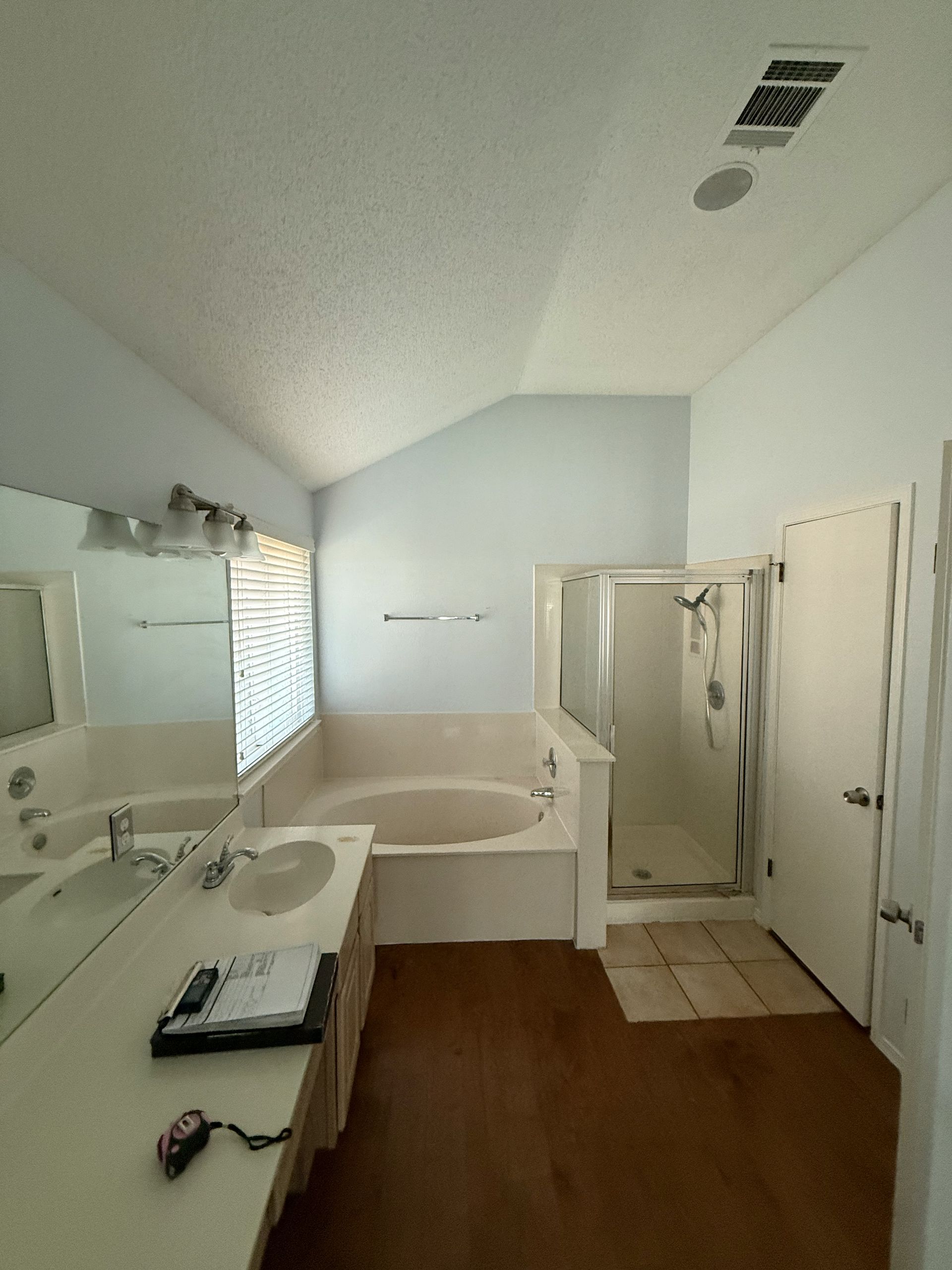 Before photo of North Austin master bath remodel with outdated shower tub and finishes