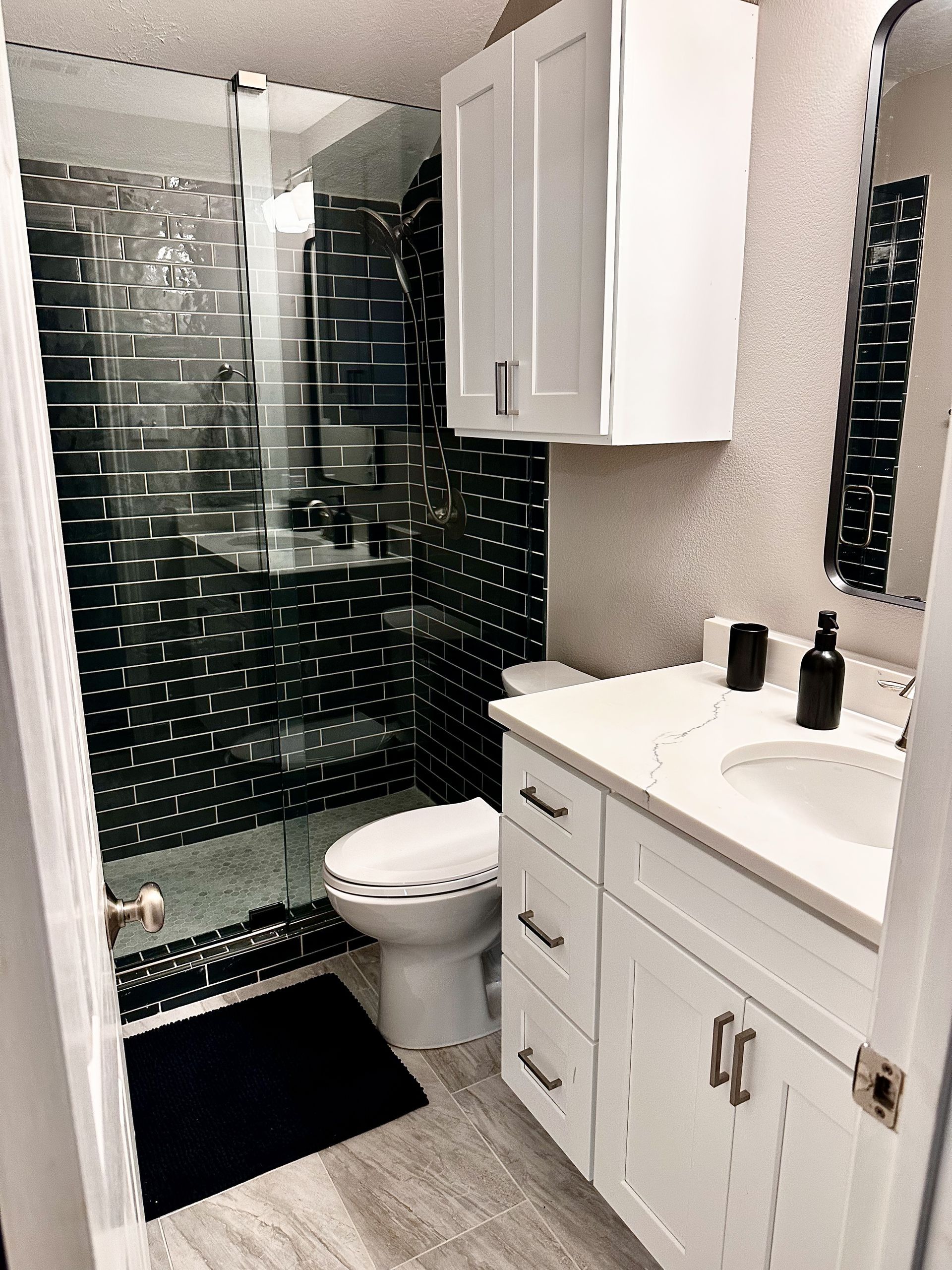 Austin guest bathroom remodel with tub to shower conversion tile frameless sliding glass 
