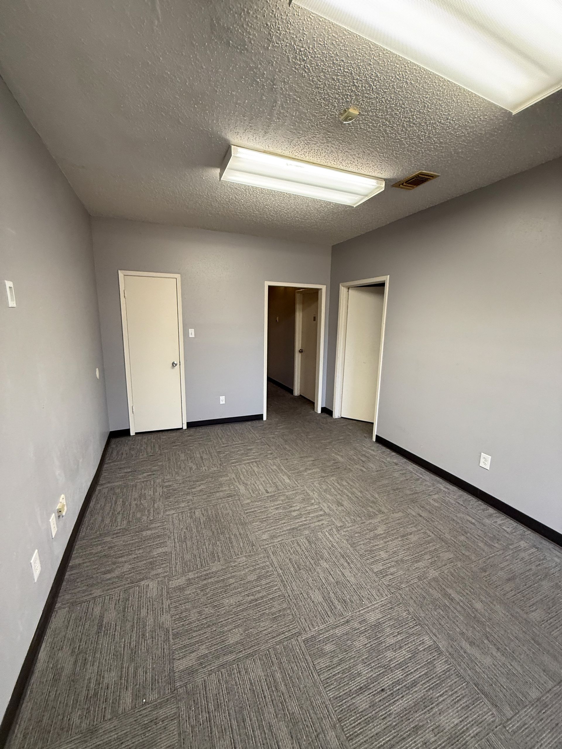 Before photo of Austin Painting and Cabinets showroom before renovation in Austin TX