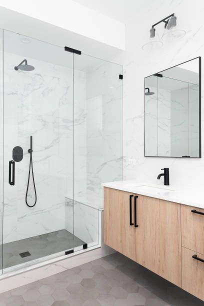 Walk-in shower vs bathtub comparison for a 2026 Austin bathroom remodel with tile, glass, and modern finishes