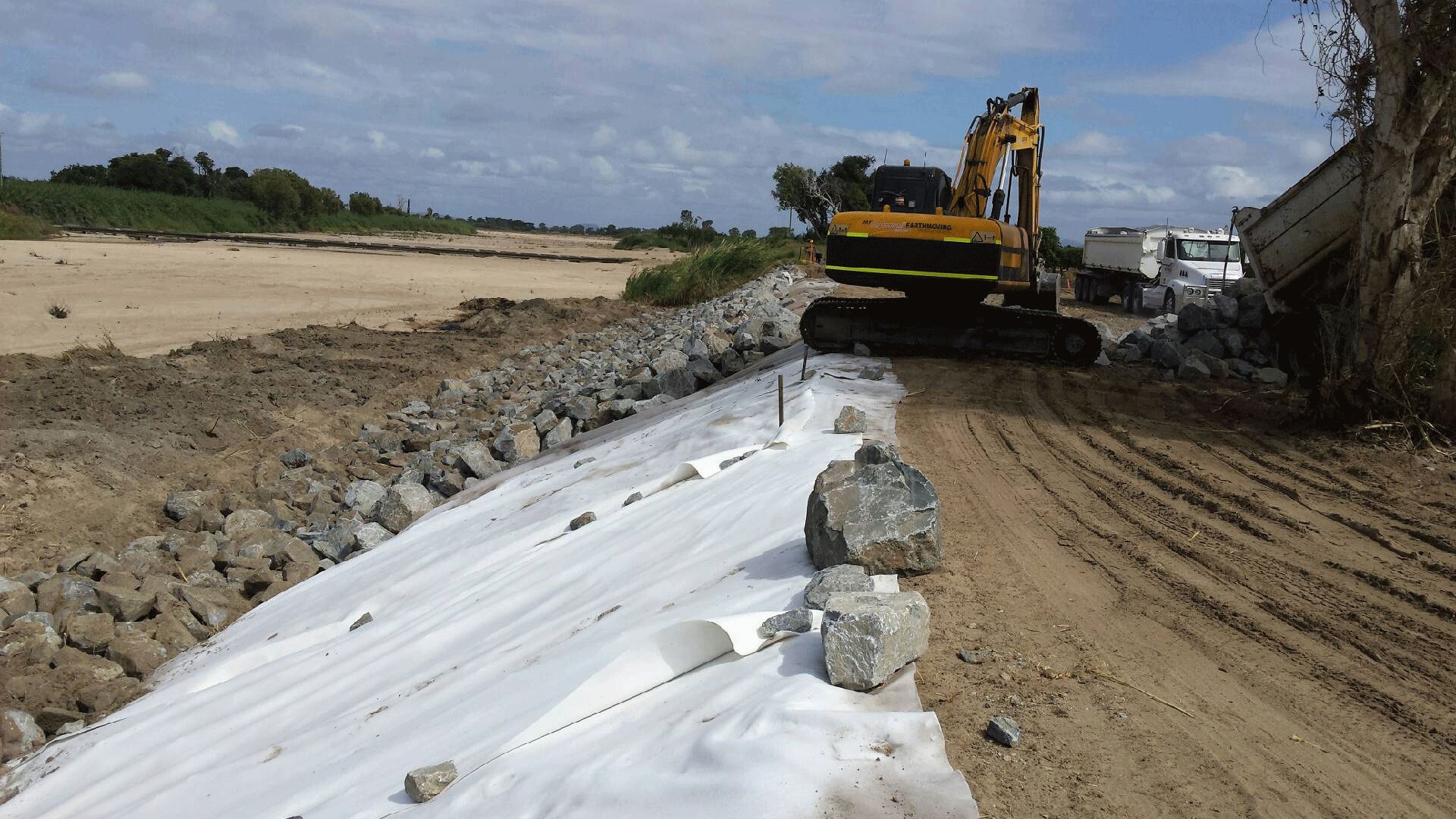 Excavator on Pile of Gravel - Excavation in Bowen, QLD