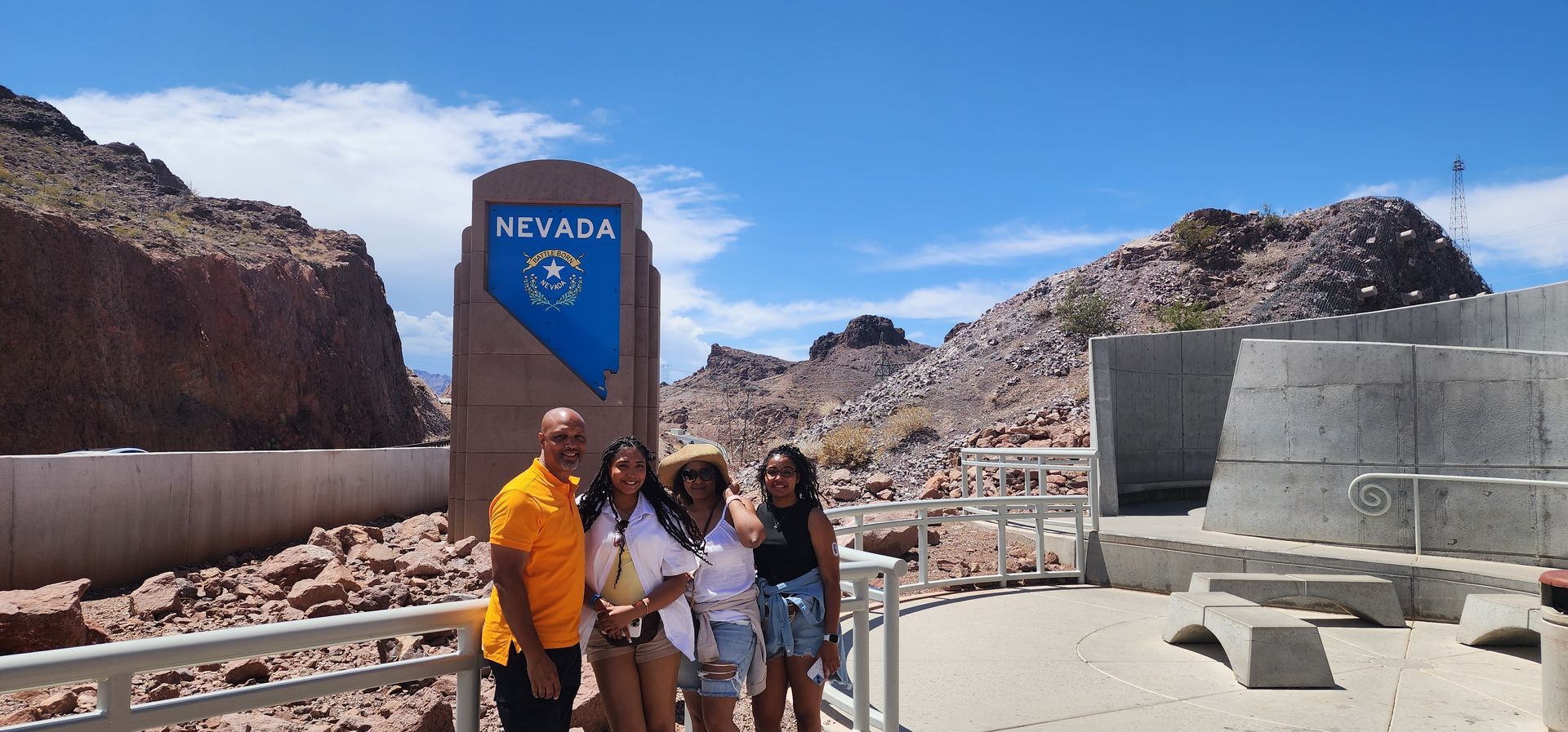 a group of people standing in front of a sign that says nevada