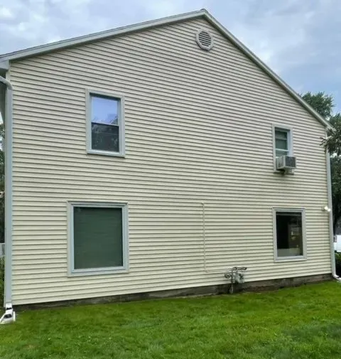 Power washing a house