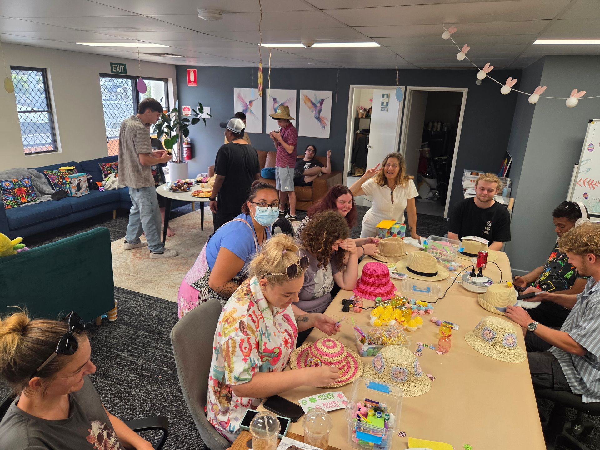 A Man Is Laying On A Couch While A Woman Writes On A Clipboard — Advanced Therapy Mackay In Mackay, QLD 