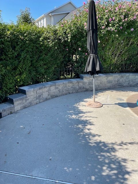 Black Umbrella On A Concrete Patio — Enola, PA — J & C Landscaping